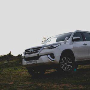 Silver Toyota Fortuner SUV on a dirt road